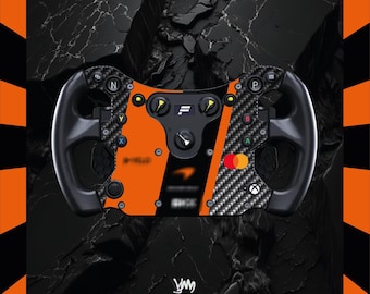 May include: A black and orange racing wheel with carbon fibre accents. The wheel features buttons, dials, and the McLaren logo. The background is a dark, textured surface with an orange and black border.