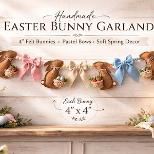 May include: Handmade Easter bunny garland featuring felt bunnies with pastel bows. Each bunny is 4 inches by 4 inches. The garland includes soft spring decor.