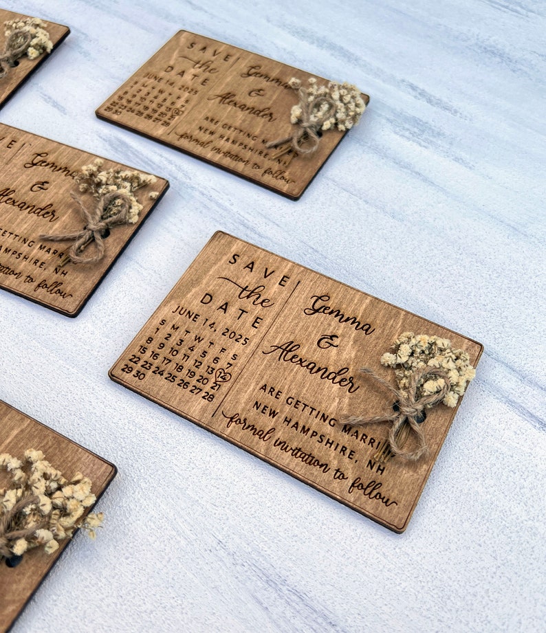 May include: Save the Date wedding announcement with a rustic wooden design. The announcement features a calendar with the date June 14, 2025, and the names Gemma & Alexander. The announcement also includes the text "Are getting married, New Hampshire, formal invitation to follow".