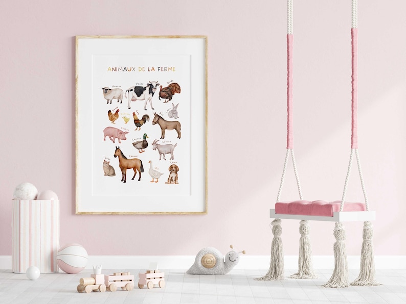 May include: A framed print titled "Animaux de la Ferme" (Farm Animals) featuring watercolor illustrations of various farm animals. The artwork is in a gold frame, displayed in a pink room with a swing and toys.