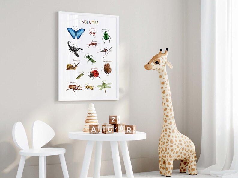 May include: A framed print titled "Insectes" displays watercolor illustrations of various insects, including a blue butterfly, a green beetle, and a scorpion. The print is displayed in a child's room with a giraffe toy and a small white table.