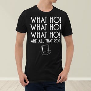 May include: Black t-shirt with white text that reads "What ho! What ho! What ho! And all that rot" with a small black and white top hat graphic.