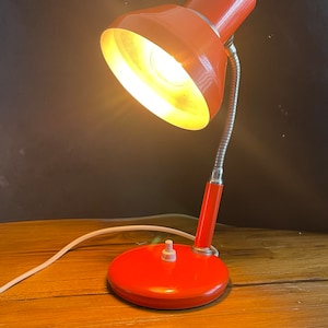 Red metal desk lamp from the 70s Italy
