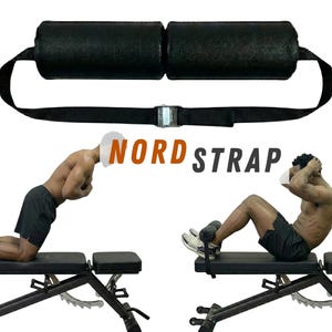 May include: Black Nord Strap exercise equipment. The equipment includes two padded black rollers connected by a black strap with a metal buckle. The image also shows two people using the equipment on a weight bench.