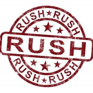 May include: Red rubber stamp with the word "RUSH" in a bold, distressed font. The word "RUSH" is repeated four times around the outer edge of the stamp, with a star between each word.