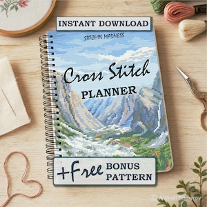 May include: A spiral-bound cross-stitch planner with a landscape design on the cover. The cover reads "Cross Stitch PLANNER" and "Instant Download". The planner is on a wooden surface with embroidery supplies.