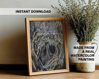 May include: A framed print featuring the text "CARLSBAD CAVERNS NATIONAL PARK" above a pixelated image of a cave. The print is in a light wood frame. Text at the top reads "INSTANT DOWNLOAD" and at the bottom right, "MADE FROM A REAL WATERCOLOR PAINTING."