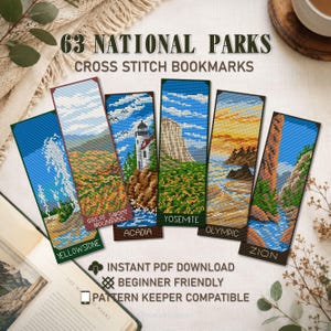 May include: A collection of six cross-stitch bookmarks featuring national park landscapes, including Yellowstone, Great Smoky Mountains, Acadia, Yosemite, Olympic, and Zion. The bookmarks are rectangular with detailed stitched designs and the text "63 NATIONAL PARKS CROSS STITCH BOOKMARKS".