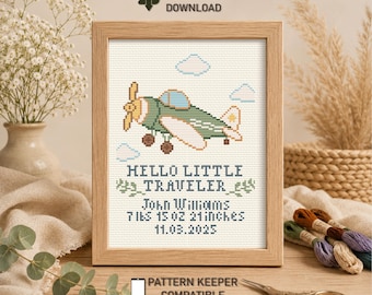 May include: A framed cross-stitch pattern featuring a green airplane, blue clouds, and the text HELLO LITTLE TRAVELER, John Williams, 7lbs 15 oz 21inches, 11.03.2025. The design includes INSTANT PDF DOWNLOAD and PATTERN KEEPER COMPATIBLE text.