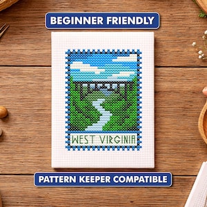 May include: A cross-stitch of a West Virginia landscape featuring a bridge over a river, surrounded by green trees and a blue sky. The text "BEGINNER FRIENDLY" and "PATTERN KEEPER COMPATIBLE" are displayed on the top and bottom.