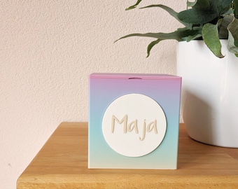 Colorful rainbow money box with change button – a personalized gift for children