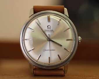 Vintage 1964 Omega Seamaster Automatico da uomo in acciaio Ref. 165.002 34 mm con scatola originale.