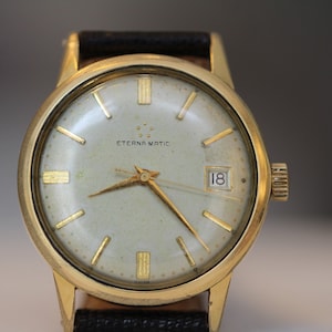 Orologio automatico Eterna Matic vintage del 1960 da 20 micron in acciaio placcato oro con impostazione di cambio rapido del calendario. Eterna Cal. Cinturino originale per portamonete 1426