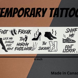 May include: A sheet of temporary tattoos with various designs and phrases, including "Foot Freak", "Horny Footlover", "Toe Sucker", and "Sniff Me". The sheet measures 8 inches by 2.5 inches.