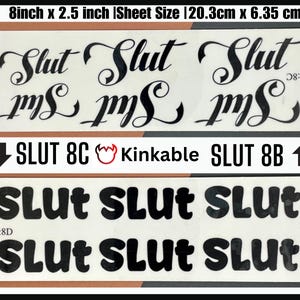 May include: Two sheets of black and white iron-on transfer paper with the word "Slut" printed in different styles. The top sheet features the word "Slut" in a cursive font, while the bottom sheet features the word "Slut" in a bold, blocky font. The sheets are 8 inches by 2.5 inches and are labeled "Slut 8C" and "Slut 8B".