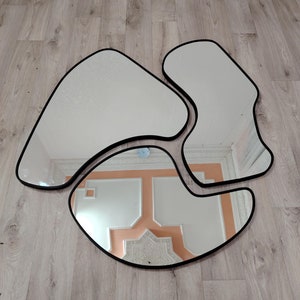 Asymmetrical Mirror: Unique Black Framed Wall Decor