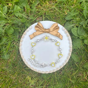 Handmade Yellow Chain Bracelet with Pearls and Yellow Hearts finished with a Yellow Flower Charm as Centrepiece. Adjustable to Fit All