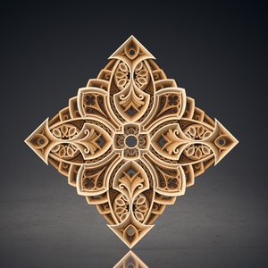 May include: A detailed, intricate, diamond-shaped design with a gold finish. The design features a central flower with four symmetrical petals, each with a complex pattern of leaves and swirls.