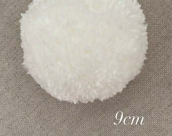 May include: A white fluffy pom pom, 9 inches in diameter.