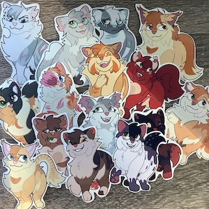 Op de afbeelding: Een set van 13 kleurrijke katten stickers met verschillende poses en uitdrukkingen. De stickers bevatten een verscheidenheid aan kattenrassen, waaronder tabby, calico en Siamese. De stickers zijn perfect om een ​​toets van whimsy toe te voegen aan laptops, waterflessen, dagboeken en meer.