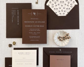 May include: A brown and white wedding invitation suite with a key design. The invitation features the couple's names, wedding date, and location. The RSVP card includes a space for the guest's name and a choice to RSVP "I can't wait" or "I can't attend". The details card includes information about the wedding reception.