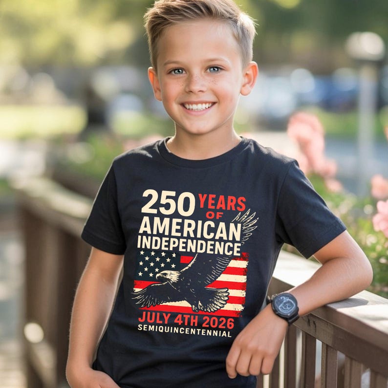 Young boy wearing navy blue America 250 patriotic tshirt featuring bald eagle and distressed American flag celebrating July 4th 2026 semiquincentennial patriotic youth apparel.