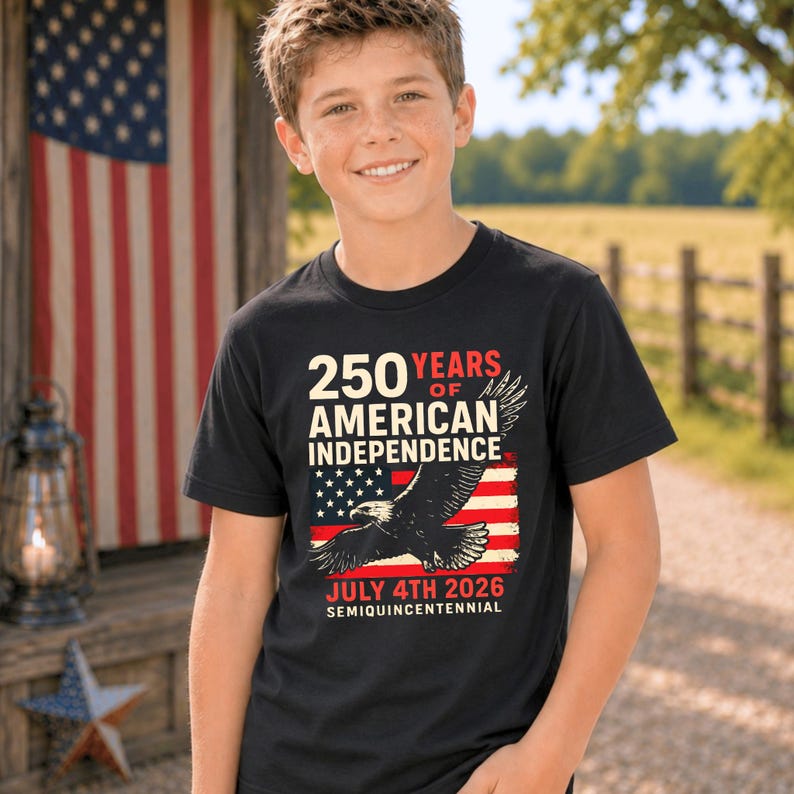 Youth boy wearing black patriotic America 250 tshirt with eagle and American flag graphic celebrating July 4th 2026 semiquincentennial patriotic shirt for boys kids and youth.