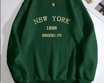 Sudadera New York verde oscuro - Estilo letras doradas