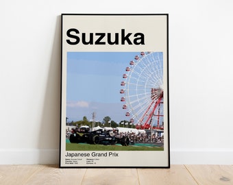 May include: A poster with a black frame and a white background. The poster features a black and white photo of a race car driving on a track with a large Ferris wheel in the background. The text "Suzuka" is at the top of the poster in black text. The text "Japanese Grand Prix" is at the bottom of the poster in black text. The text "Name: Suzuka Circuit" is below the text "Japanese Grand Prix". The text "Distance: 5.807 km" is below the text "Name: Suzuka Circuit". The text "First Held: 1962" is below the text "Distance: 5.807 km". The text "Capacity: 130,000" is below the text "First Held: 1962".