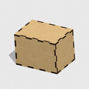 Puede incluir: Una caja de madera con un borde negro. La caja está hecha de madera clara y tiene una superficie lisa.