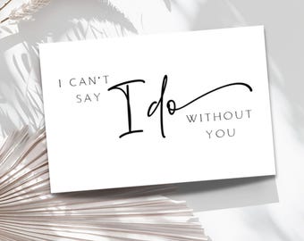 May include: A white card with black calligraphy that reads "I can't say I do without you".