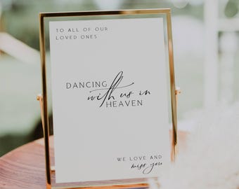 May include: A gold-framed sign with the text "To all of our loved ones, Dancing with us in heaven, We love and miss you".