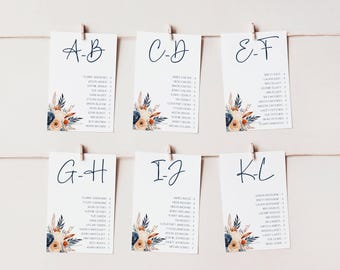 May include: Six white cards with blue calligraphy letters and floral designs. The cards are labeled A-B, C-D, E-F, G-H, I-J, and K-L. Each card lists names in alphabetical order.
