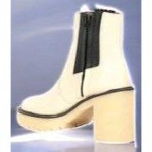 May include: White platform ankle boots with a black zip up the back. The boots have a chunky heel.