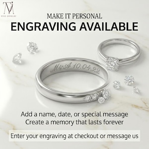 May include: Two silver rings and scattered diamonds are displayed on a white surface. One ring is engraved with "M&A 10.04.22". The text "ENGRAVING AVAILABLE" is above the rings. The text "Add a name, date, or special message Create a memory that lasts forever" is also displayed.