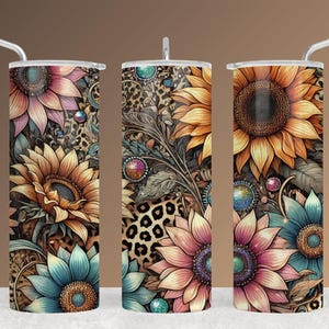 May include: Three stainless steel tumblers with floral designs. The tumblers feature sunflowers, teal and pink flowers, and leopard print accents. Each tumbler has a silver straw and a lid.