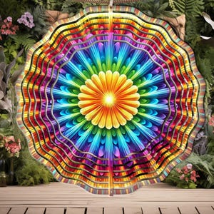 May include: A colorful metal wind spinner with a rainbow flower design. The spinner has multiple layers and is designed to spin in the wind.