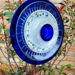 Beautiful Glass Plates get new life as a flower Yard Art to be enjoyed by everyone! Clear, Blue and Flowered Glass Custom Handcrafted