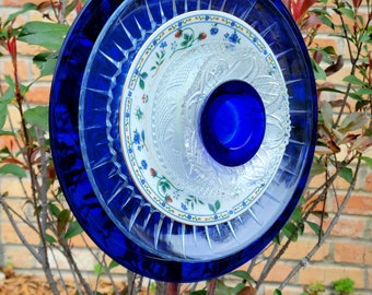 Beautiful Glass Plates get new life as a flower Yard Art to be enjoyed by everyone! Clear, Blue and Flowered Glass Custom Handcrafted