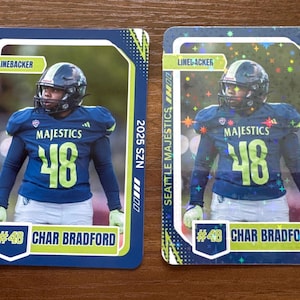 May include: Two football trading cards featuring a player in a blue and green uniform with the number 48. The cards have the text "Seattle Majestics" and "Char Bradford". One card has a holographic effect.