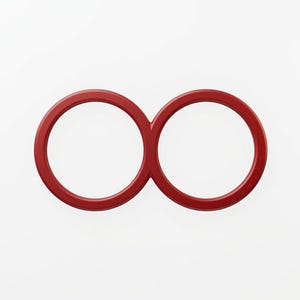 Puede incluir: Un objeto rojo en forma de infinito, posiblemente un elemento decorativo o parte de un diseño más grande. El objeto tiene una forma suave y redondeada y está sobre un fondo blanco liso. El color es un rojo intenso y saturado.