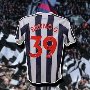 May include: A white and black striped soccer jersey with the name "BRUNO G." and the number "39" on the back. The jersey has a black NUFC logo on the upper right side of the chest.