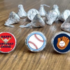 May include: Baseball-themed favor tags with red, blue, and white colors. One tag says "Happy Birthday Chase" with crossed baseball bats and a baseball. Another tag has a baseball with red stitching. The third tag has a brown baseball glove with a white baseball.