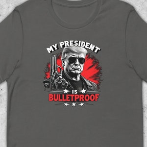 My President Is Bulletproof Trumpinator President Donald Trump MAGA Unisex Cotton T-Shirt | Based Gift For Republican American Patriot