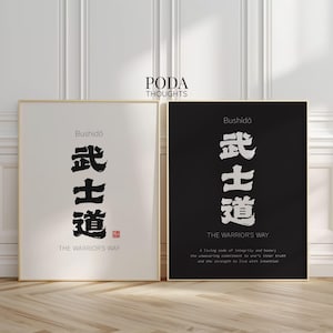 May include: Two framed art prints with gold frames. One print has a white background with black Japanese calligraphy and the text "Bushido" and "The Warrior's Way." The other print has a black background with white calligraphy and text.