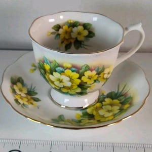Vintage Royal Albert Bone China England Tea Cup Saucer Yellow Primrose pattern Victorian floral theme. Printed backstamp charming 2 piece