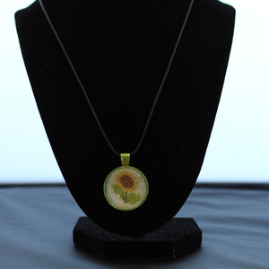 Handmade Cross Stitch Sunflower Pendant Necklace: Green Bezel