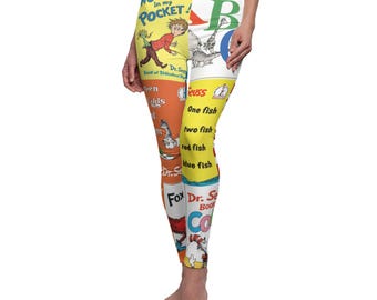 May include: Yellow and orange leggings with a colorful pattern of Dr. Seuss book covers. The covers include "There's a Wocket in My Pocket", "Green Eggs and Ham", "One Fish Two Fish Red Fish Blue Fish", and "The Cat in the Hat".
