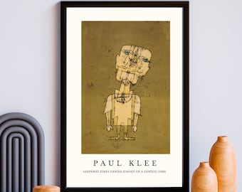 May include: A framed print of a painting by Paul Klee titled "Gespenst eines Genies (Ghost of a Genius)" (1922). The painting depicts a stylized human figure with a yellow head and body, standing on a green background.