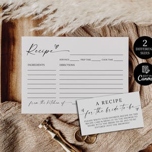 May include: Two recipe cards with the word "Recipe" at the top, and a smaller card that says "A Recipe for the bride-to-be". The cards are on a wooden tray with a gold-colored bottle opener and two gold coins. The text "2 Different Sizes" is also visible.